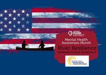 Silhouetted figures paddle in a canoe on a dark blue background with the american flag 